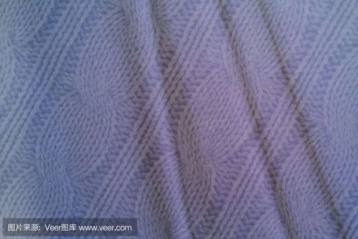 复古风格的蓝色纺织品背景——皱巴巴的波浪织物和针织纹理